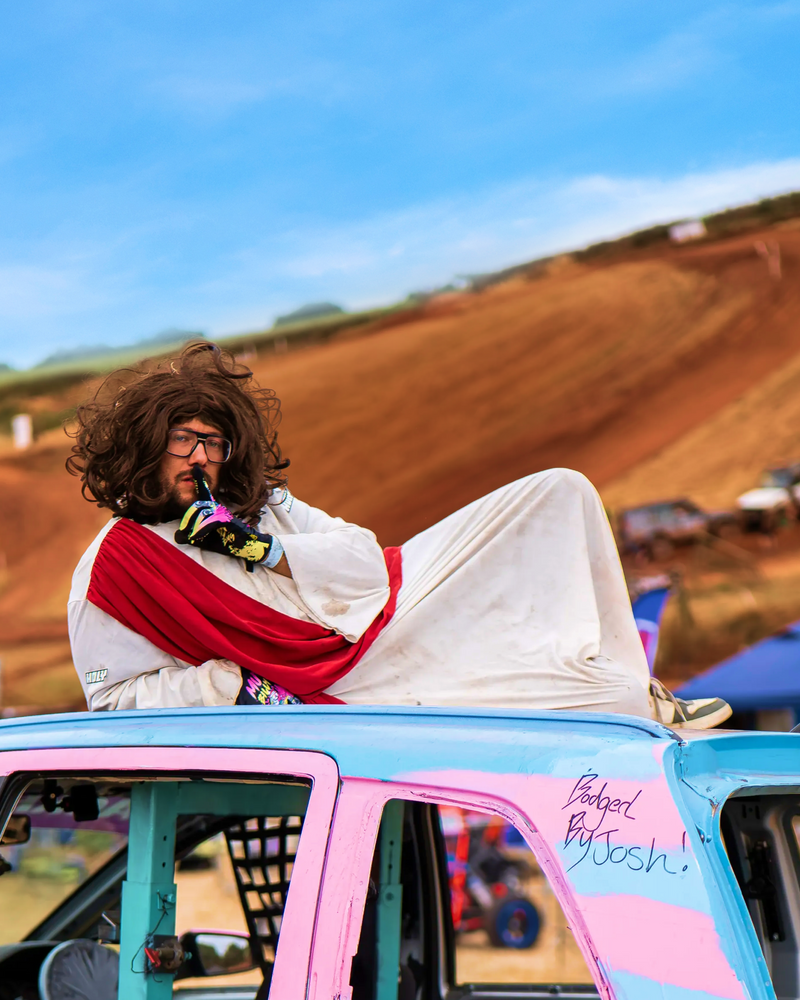 <p>Backfire Brad AKA Drift Jesus blessing the HOLY Moly Mobile at Mudbillys</p>
